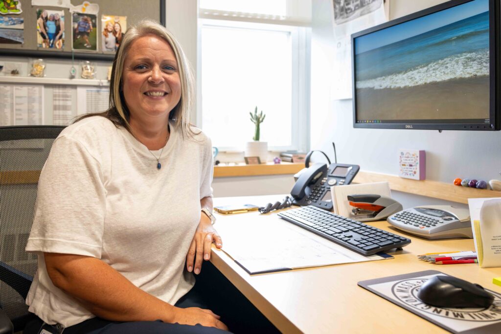 A female sits at her desk at the Wilmington Police headquarters.